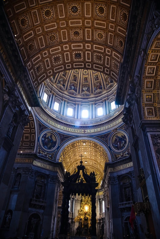 an empty, elaborately decorated church with a skylight