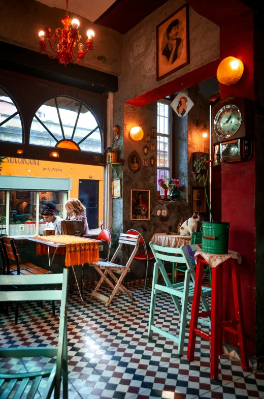 two people are sitting at the table in a restaurant