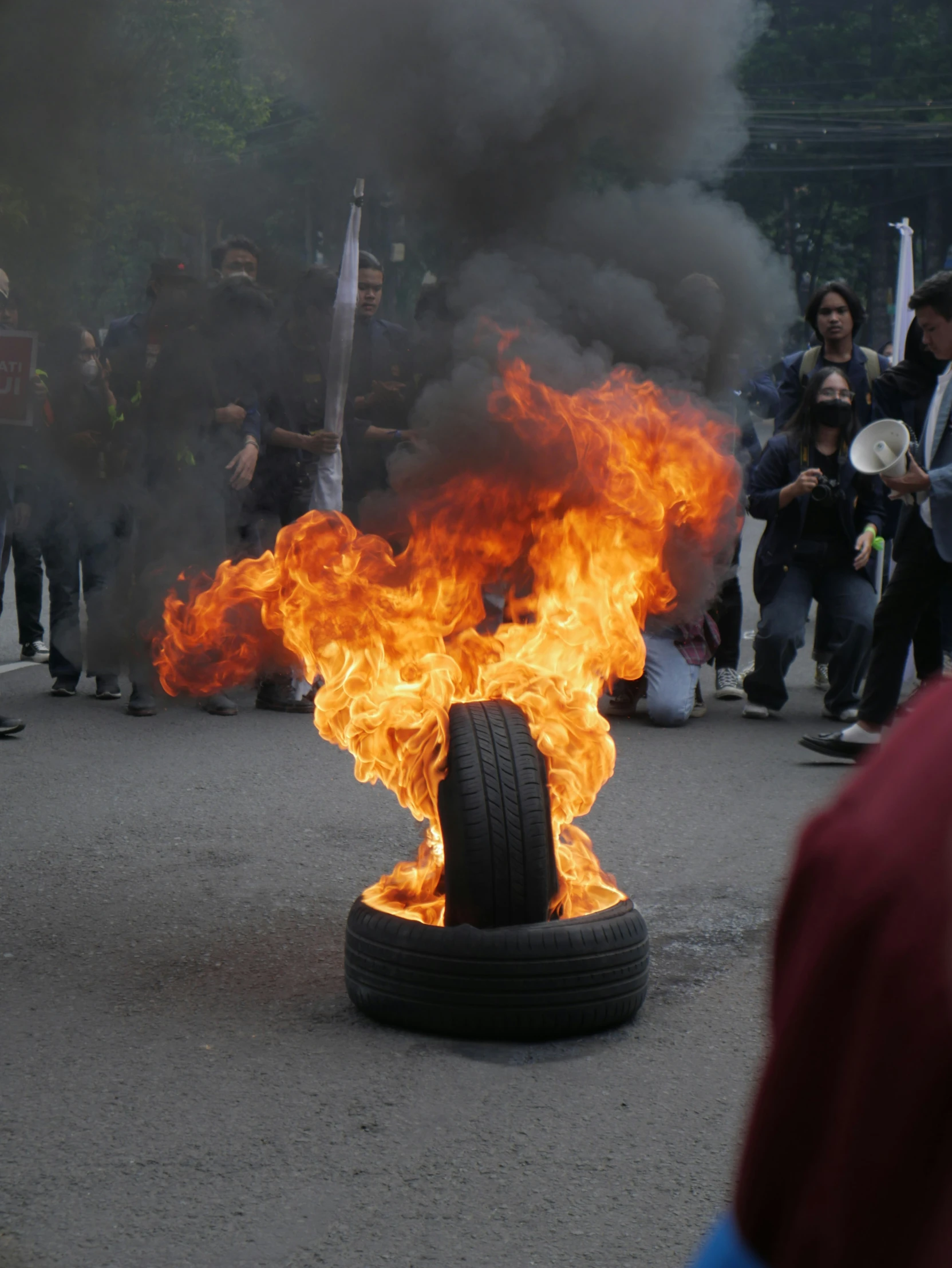 there is a large fire on top of a tire