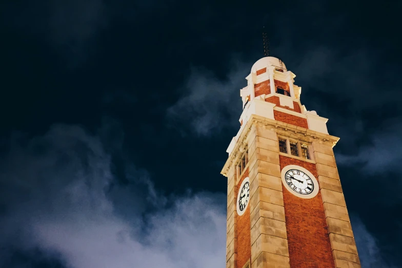 a clock tower in the sky on a cloudy day