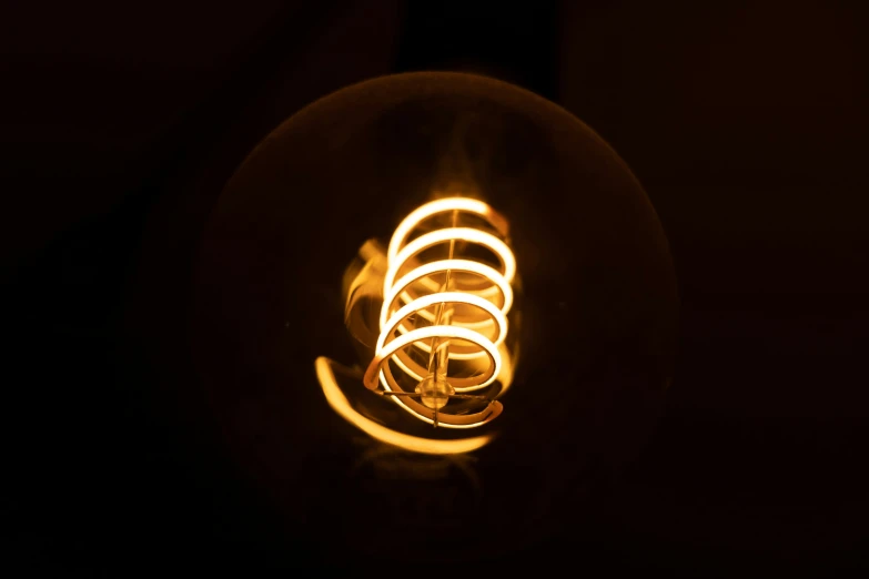 a light bulb is shown in the darkness