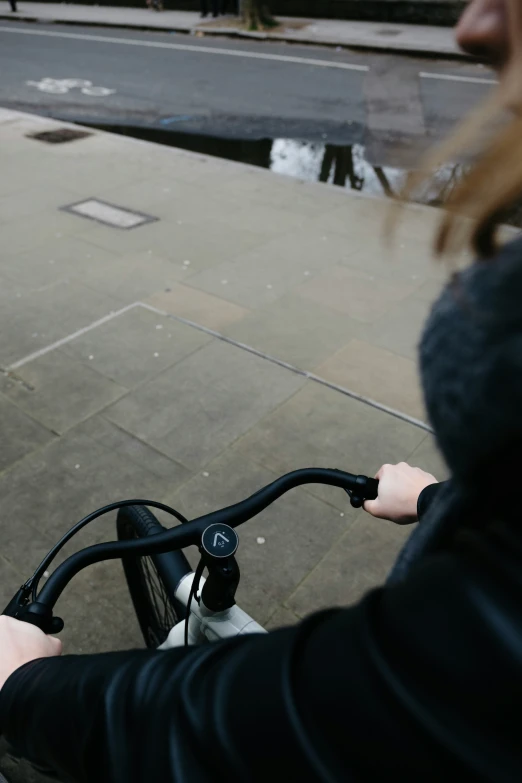 a woman riding her bike down the street