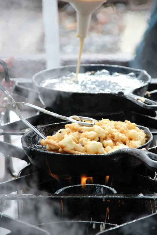 some large cooking plates with food on them