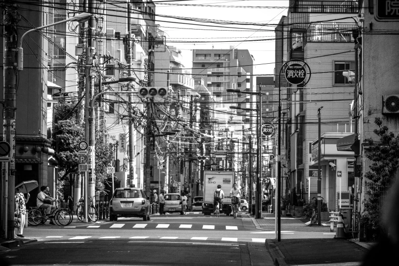 cars are driving on a city street