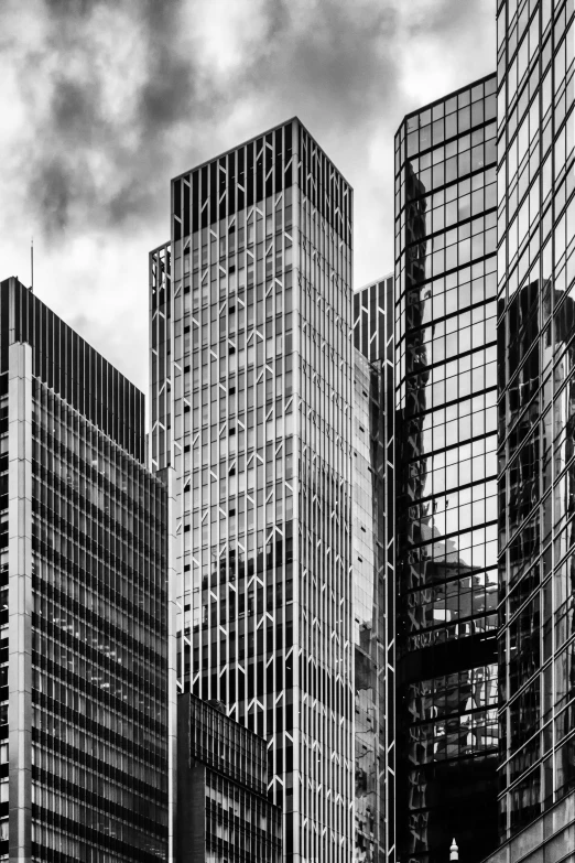 many tall buildings in the city during cloudy weather