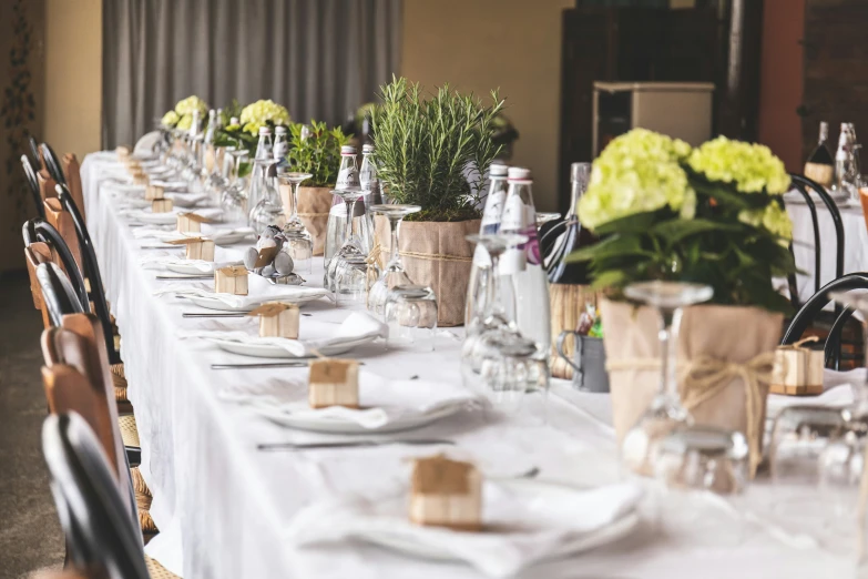 this is a pograph of the long table with flower centerpieces