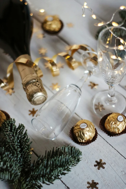 some christmas food and champagne on a table