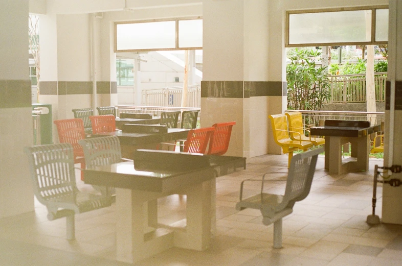 a room with several chairs and a table