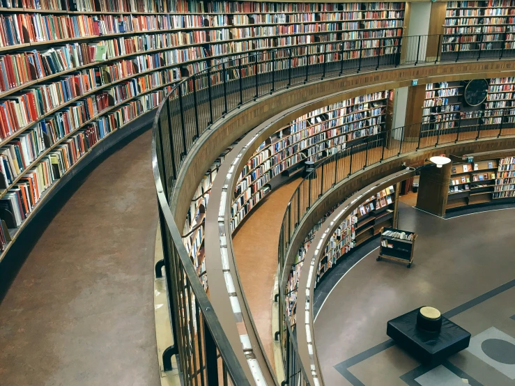 a couple of book shelves that are filled with books