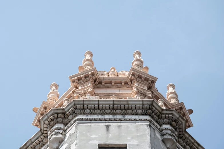 looking up at a very tall building that has a clock on it