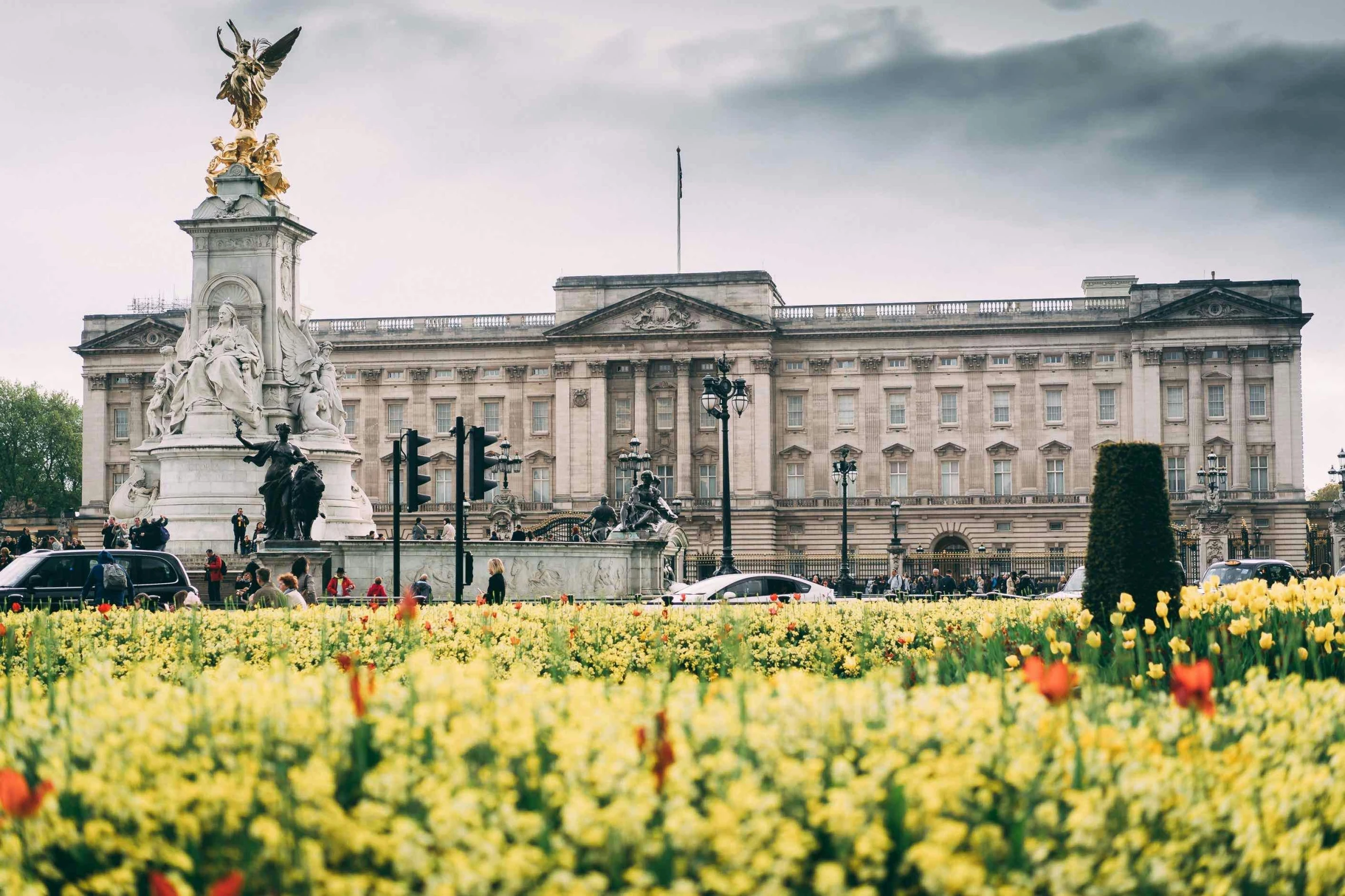 the palace is full of colorful flowers and a fountain