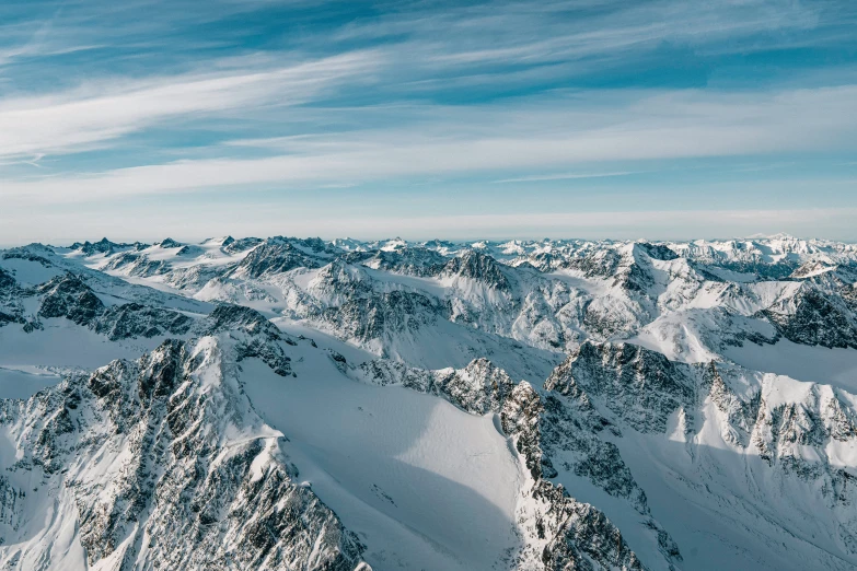 mountain top with snow, with a sky background