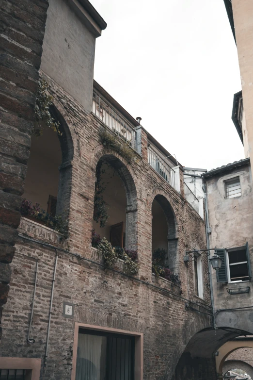 an old building is surrounded by two towers