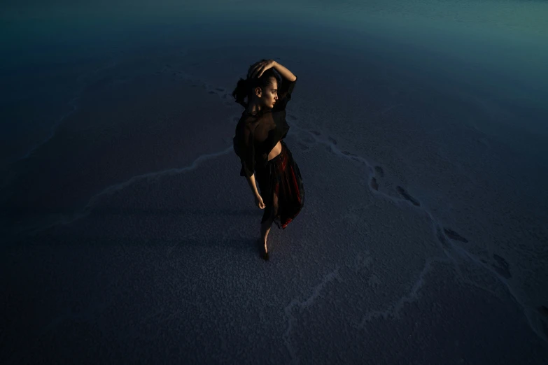 a woman is floating on the ground in a dress