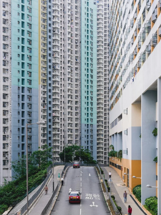 view down an empty city street from apartment buildings