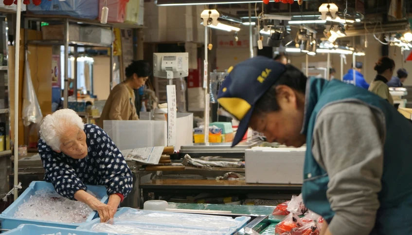 a couple of people at an industrial kitchen