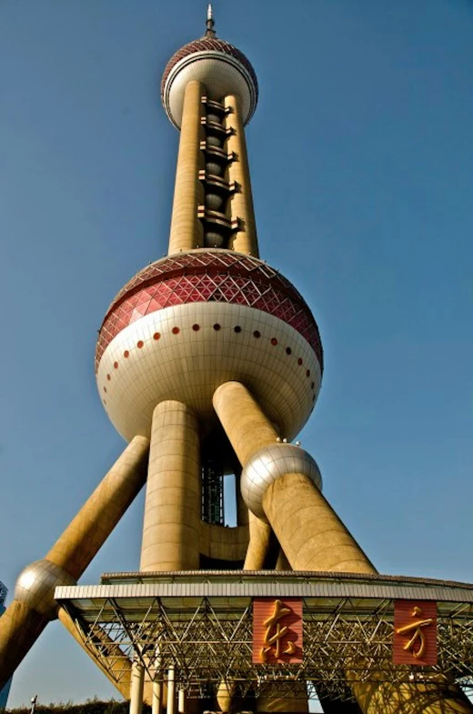 the macau tower in macau, china has a unique red top