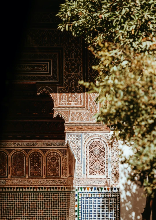 a picture taken from below, of a building with ornate walls