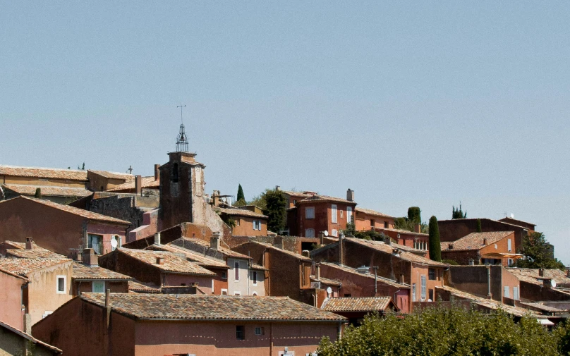 an aerial view of a small town that has many rooftops