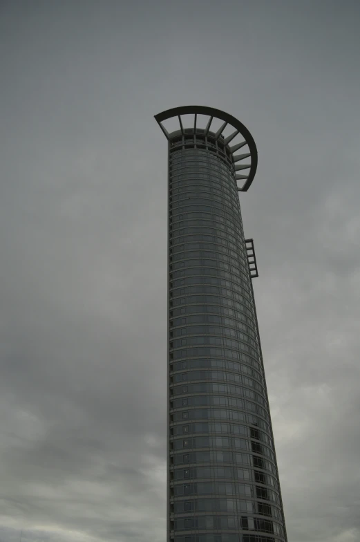 an unusual looking building that looks like the side of a clock tower