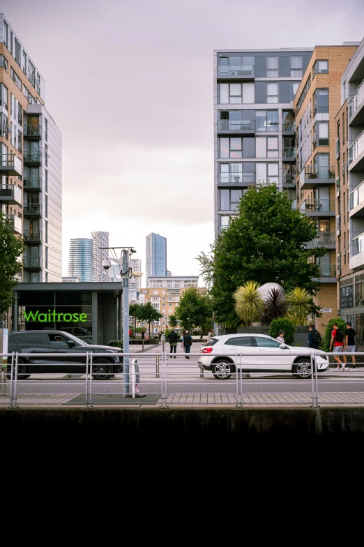 a couple of cars are parked next to buildings