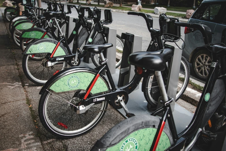 a line of bicycles sitting on the side of a road