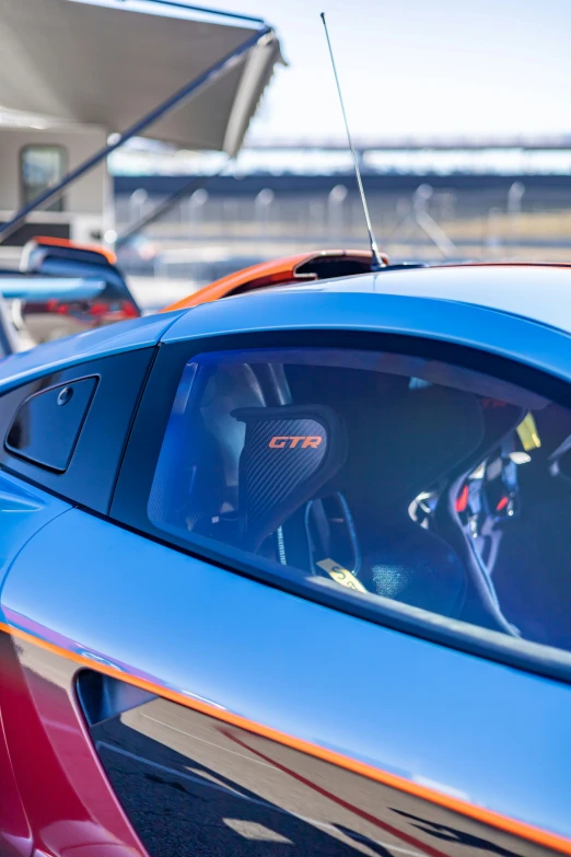 a bright blue sports car with its radio installed