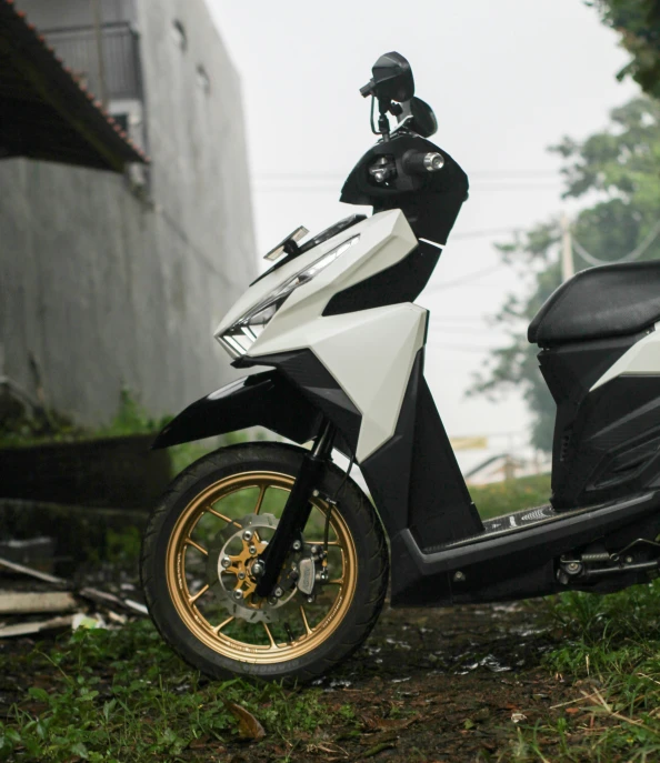 motorcycle parked in front of a building with a helmet on it