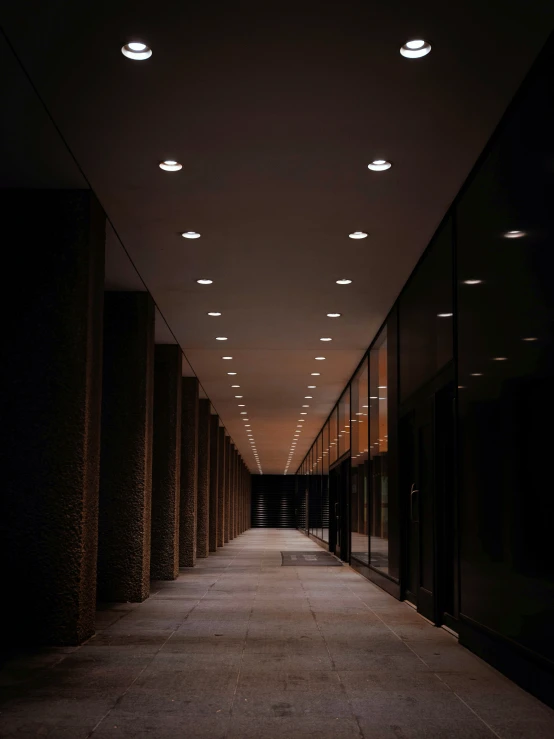 there are very long rows of lights at the end of the hallway