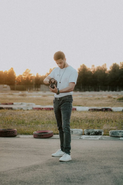 a person is standing holding an animal in his hand