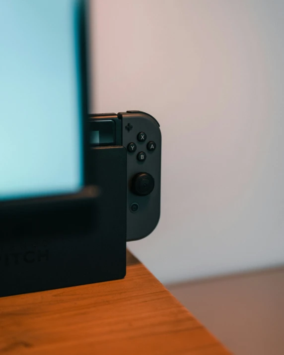 a camera and a video game system sitting on a table