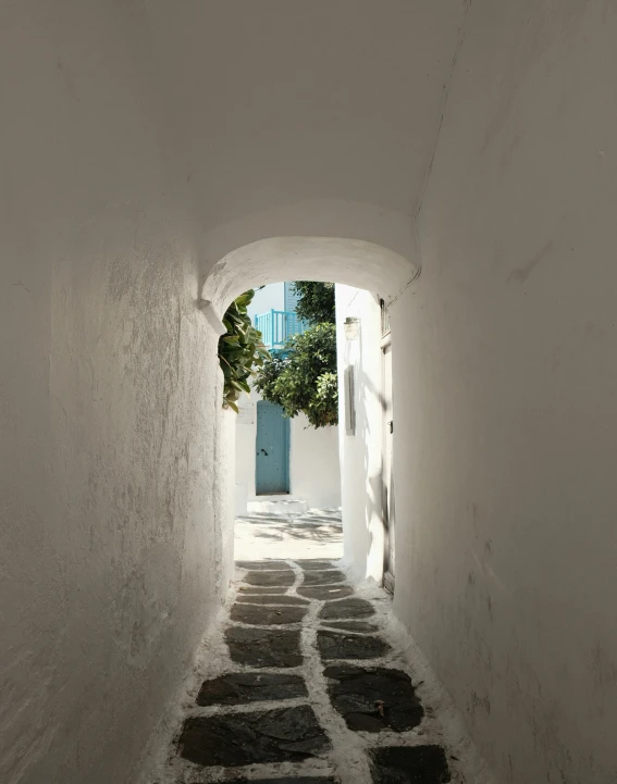 a narrow passage that leads to some doors