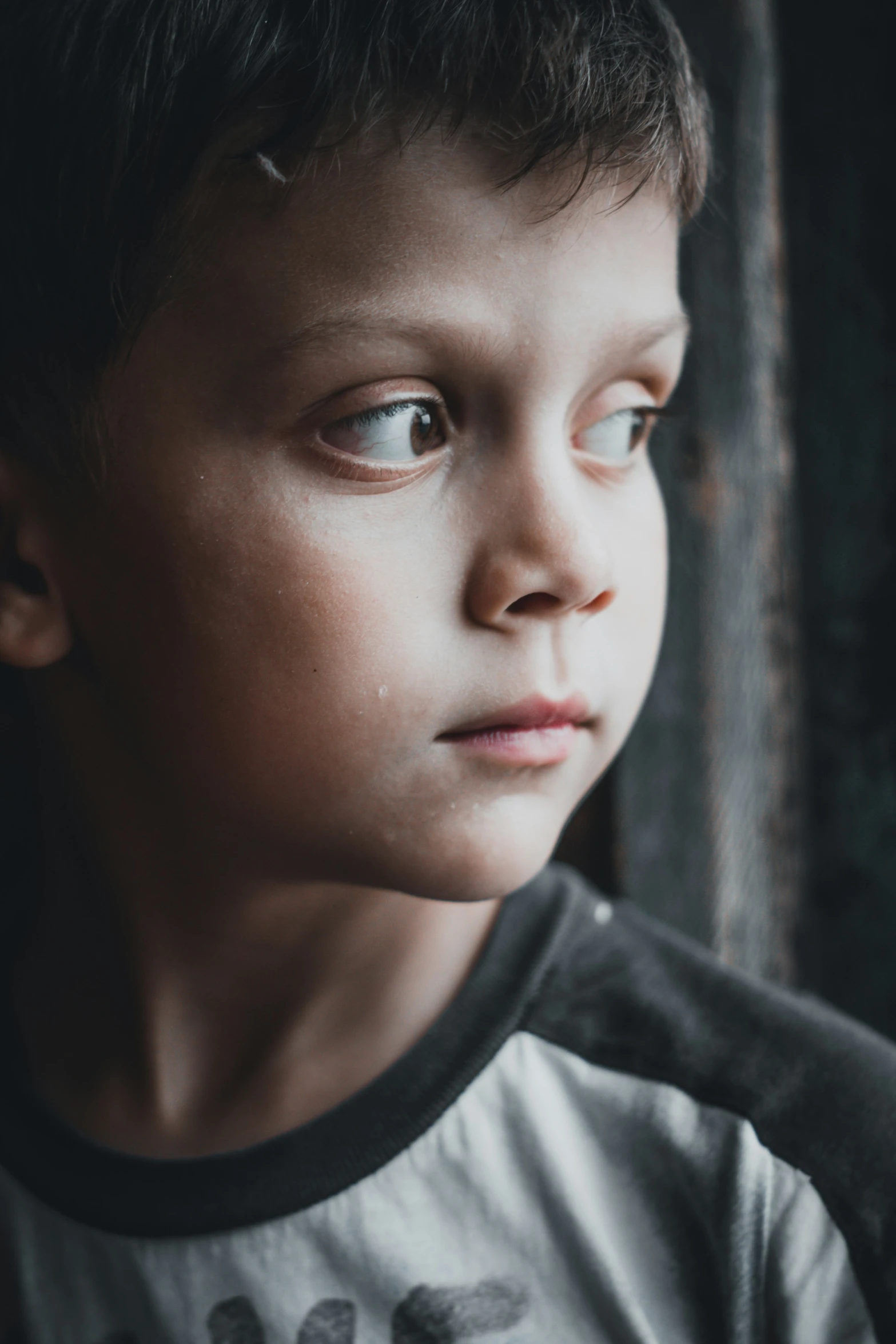 the face of an adorable little boy with big blue eyes