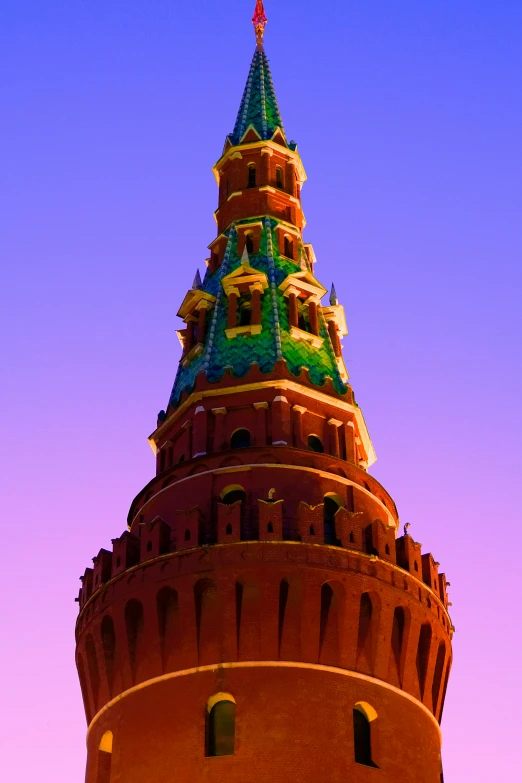 a tall brick tower with a clock on it's side