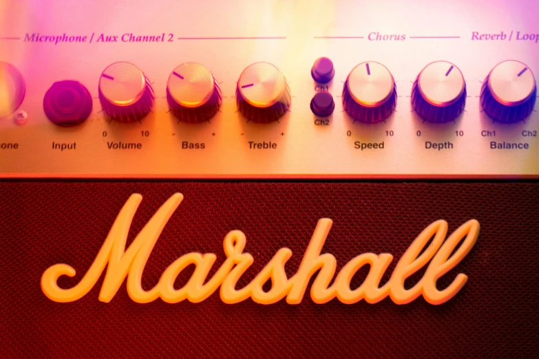 the word marshall over top of two electronics s