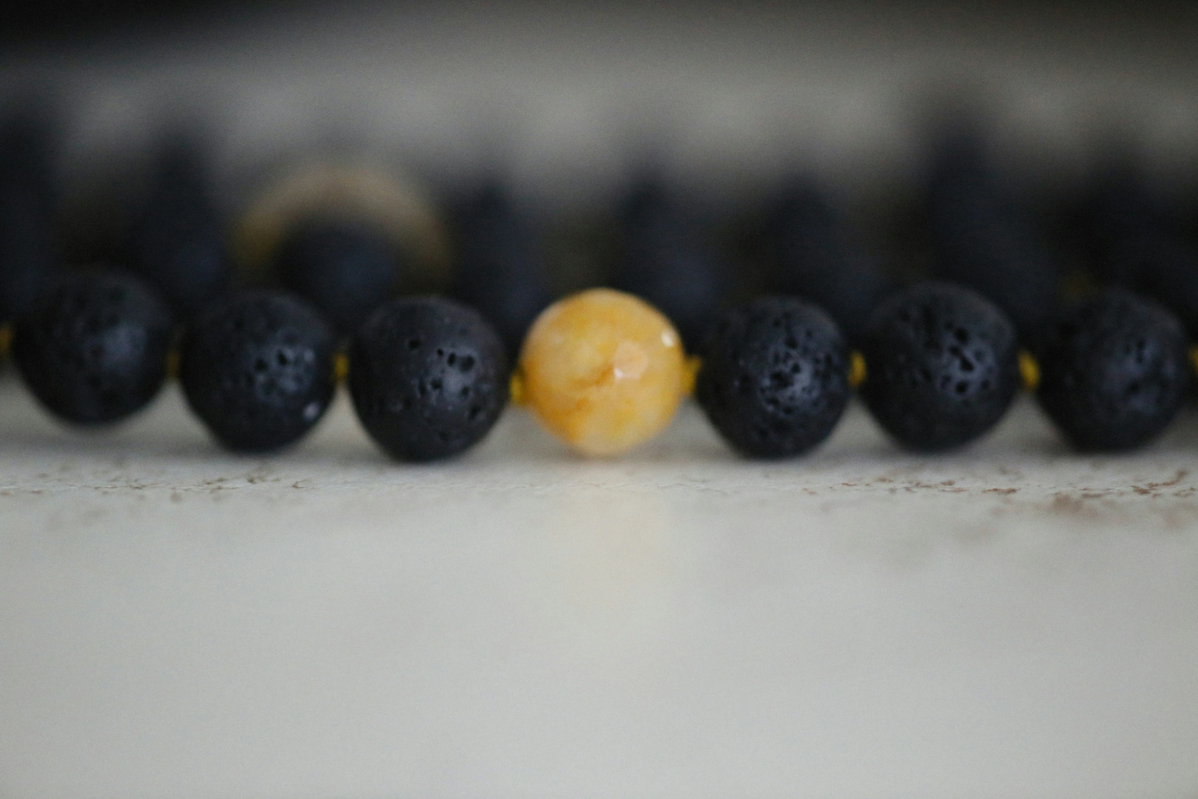 the orange sits in between black berries