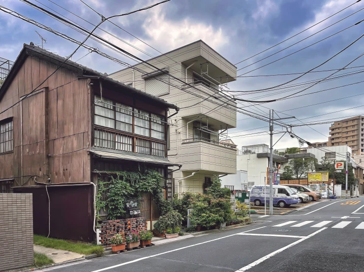 an empty street and a building on the corner