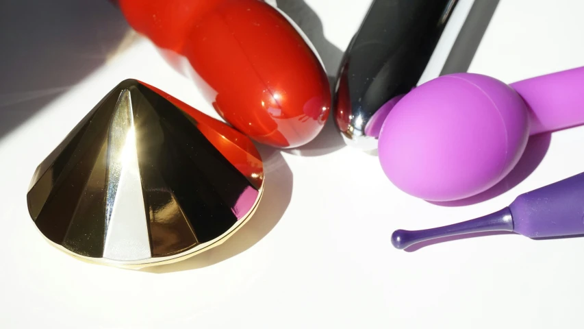 a collection of different colorful toothbrushes on a white table