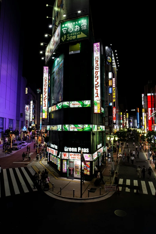 an urban area at night, with neon signs lit up