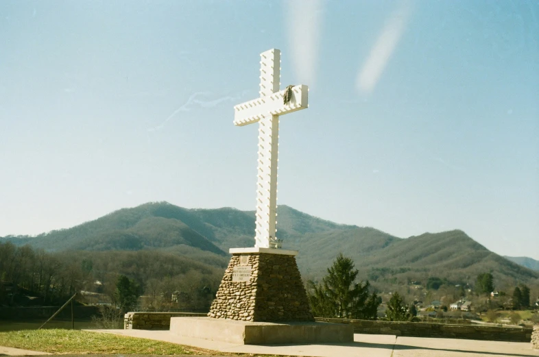 a cross is on display in the middle of the field