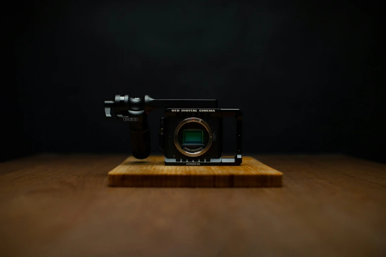 a camera that is laying on top of a board