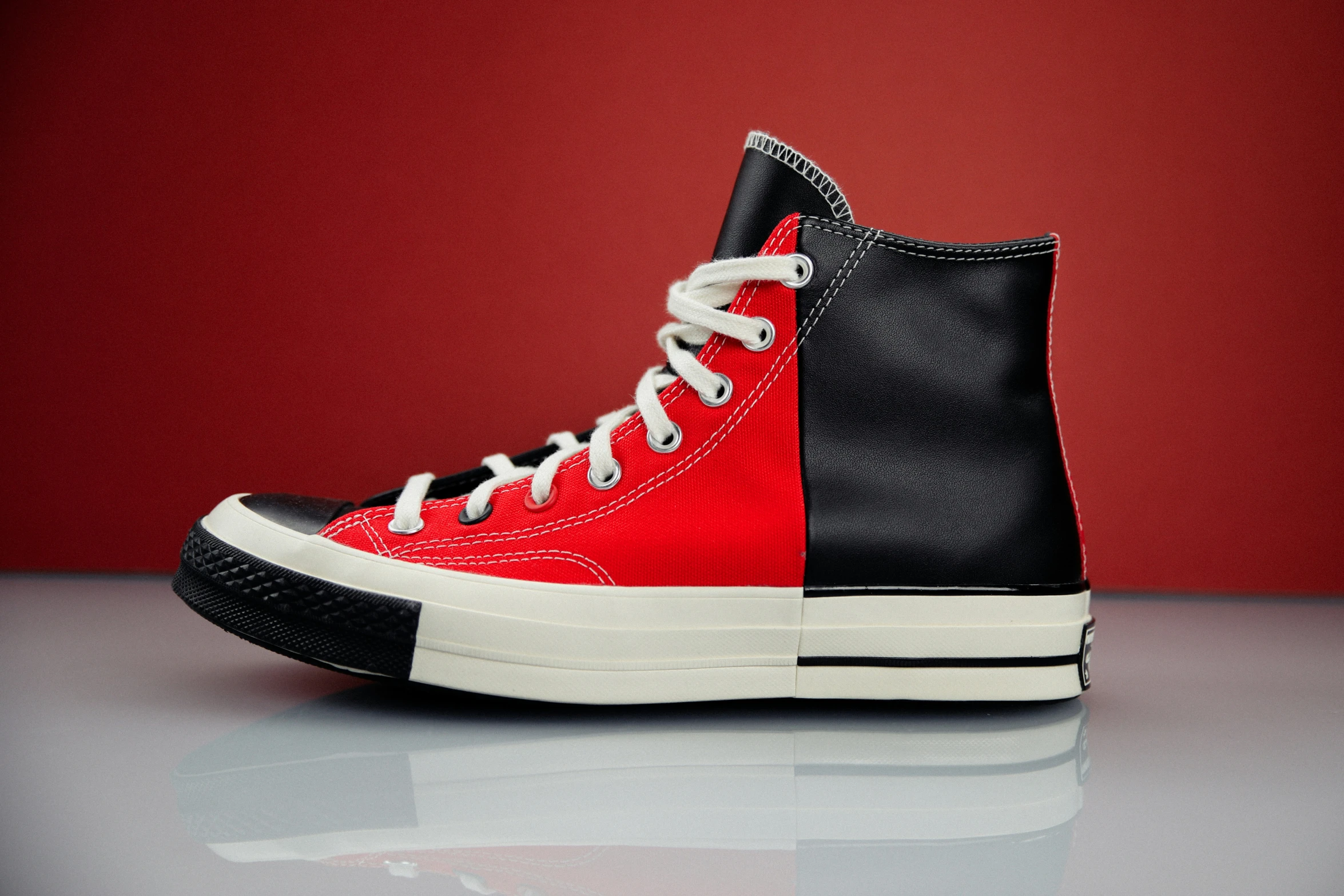 an image of a red and black converse