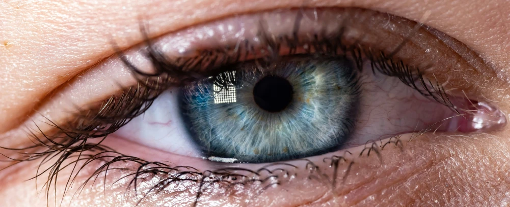 a close up view of a person's blue eye