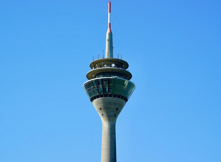 an electronic tower with two flags on top