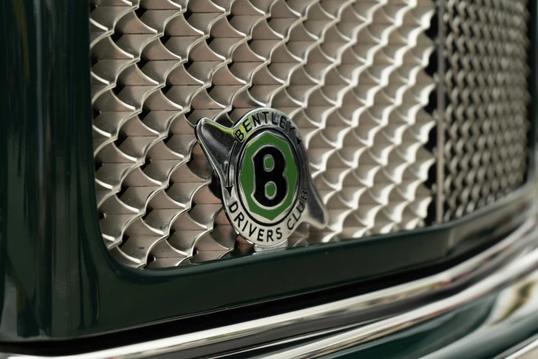 a close up of a car number six emblem on a vehicle