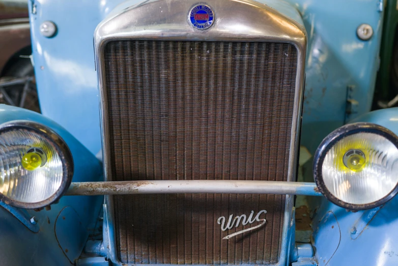 a closeup of the front grill of an old ford truck