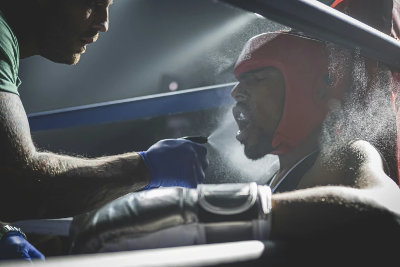 a young male boxer wearing gloves and boxing gloves