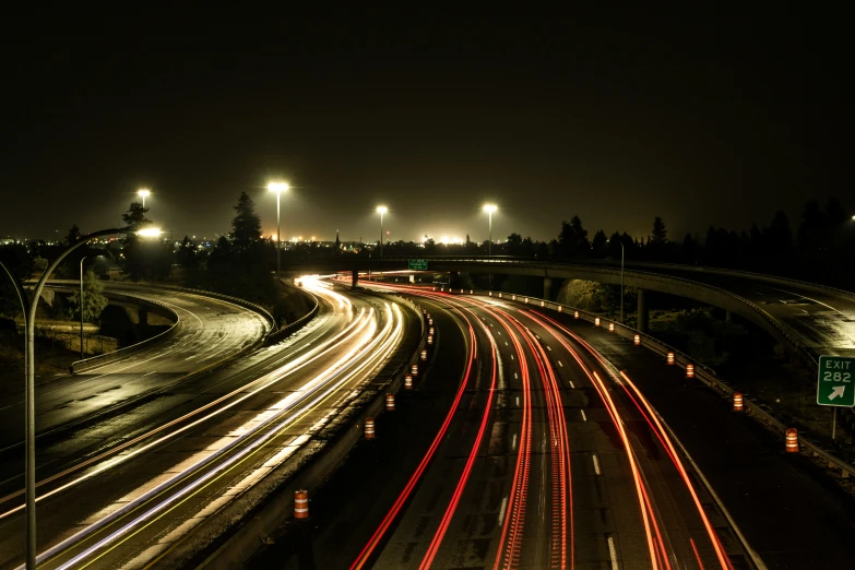 a traffic filled highway in the night with lights