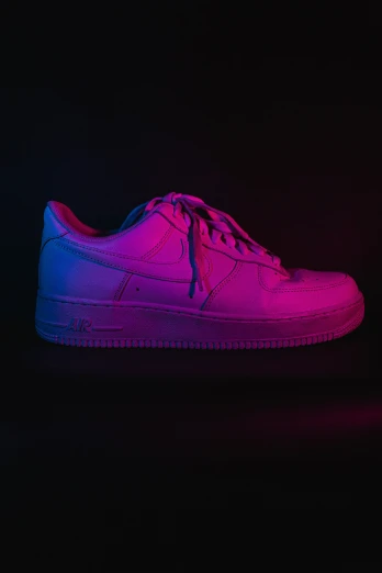 a nike air force sneakers in purple and blue