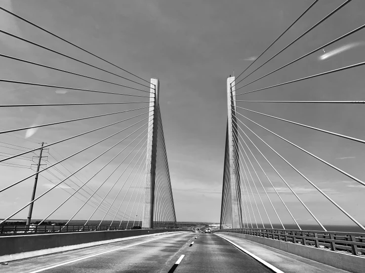 the view of a bridge from the back of the car